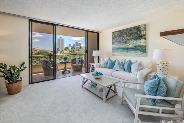 carpeted living room featuring expansive windows and a textured ceiling