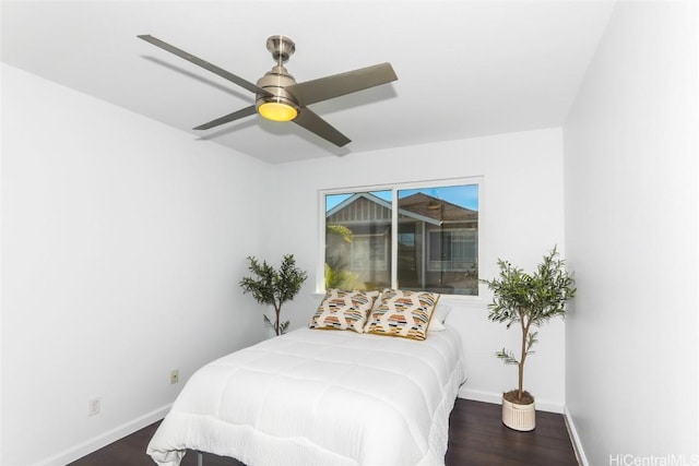 bedroom featuring dark wood-type flooring and ceiling fan