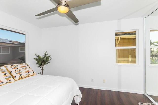 bedroom featuring dark hardwood / wood-style flooring and ceiling fan