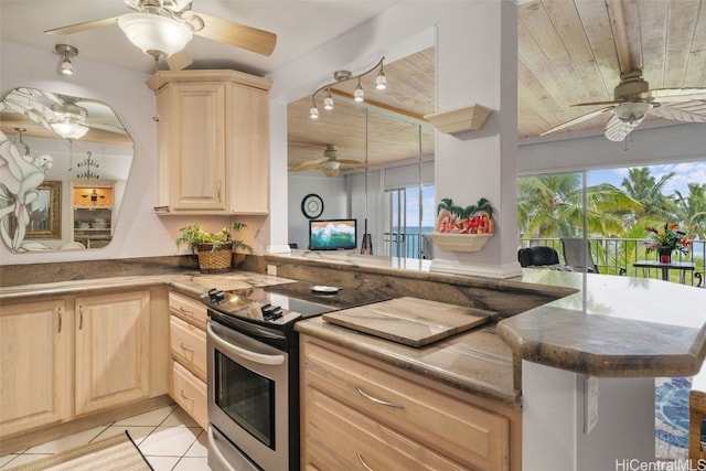 kitchen featuring kitchen peninsula, light brown cabinetry, and wooden ceiling