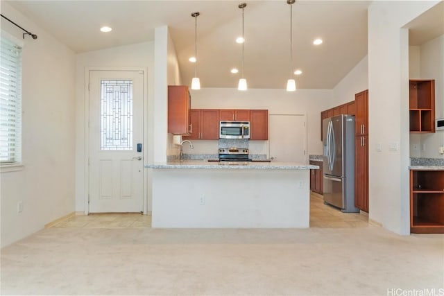 kitchen featuring light stone countertops, pendant lighting, lofted ceiling, and appliances with stainless steel finishes