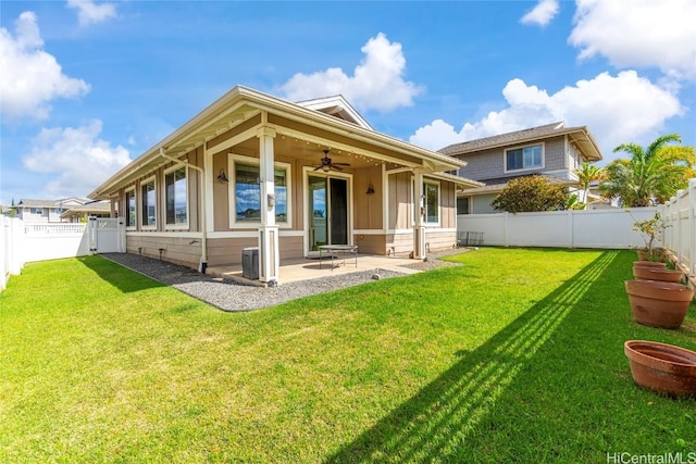 back of house featuring a lawn, a patio area, ceiling fan, and central AC unit