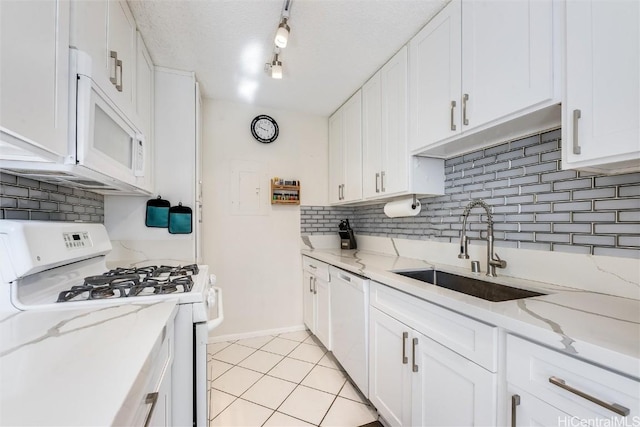 kitchen featuring white cabinetry, white appliances, and sink