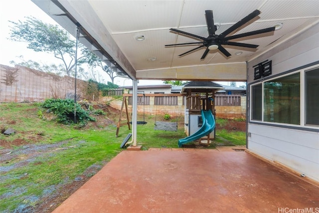 view of patio / terrace featuring a playground and ceiling fan