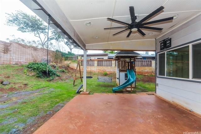 94-15 Kaweo Pl, Mililani, HI 96789 - fenced backyard with a patio, ceiling fan, and a playground