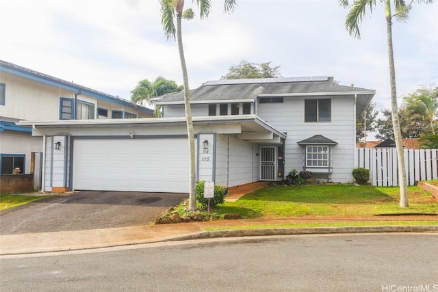 front facade with a front lawn and a garage