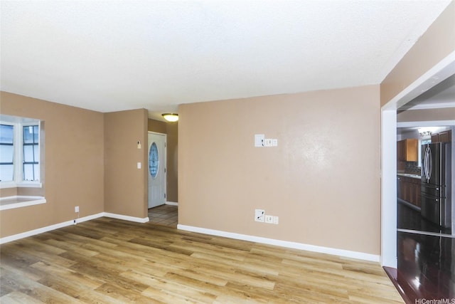 94-15 Kaweo Pl, Mililani, HI 96789 - empty room with light wood finished floors and baseboards