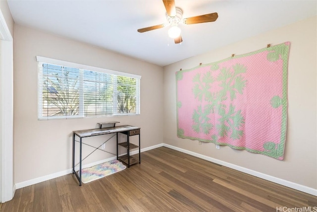 office area featuring ceiling fan, baseboards, and wood finished floors