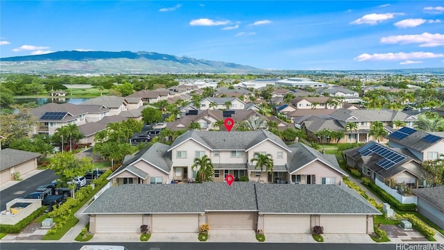 drone / aerial view featuring a residential view and a mountain view