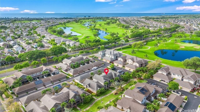 aerial view with golf course view, a water view, and a residential view