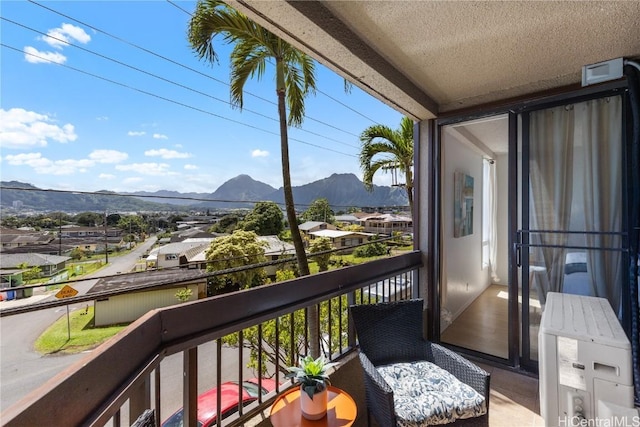 balcony featuring a mountain view