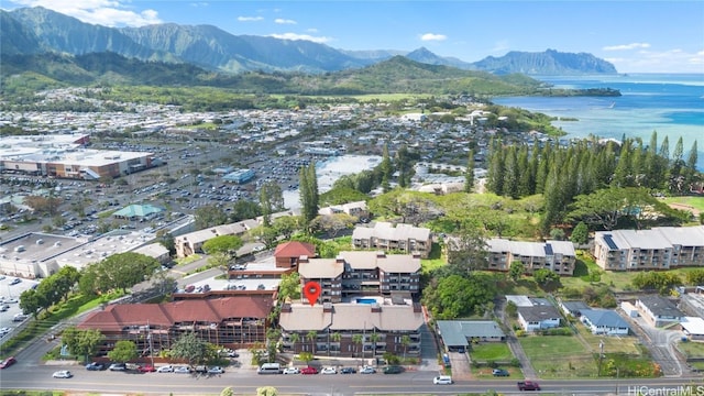 birds eye view of property featuring a water and mountain view