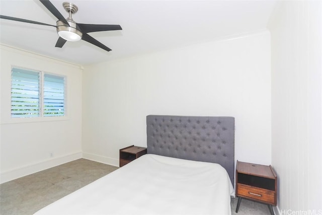 bedroom with ceiling fan and baseboards