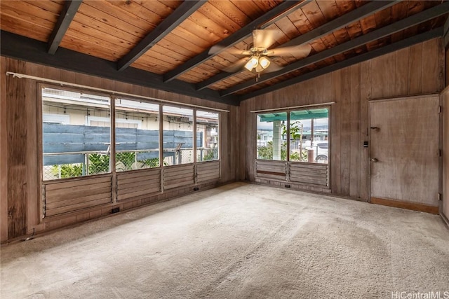 interior space featuring vaulted ceiling with beams, ceiling fan, carpet, and wooden ceiling