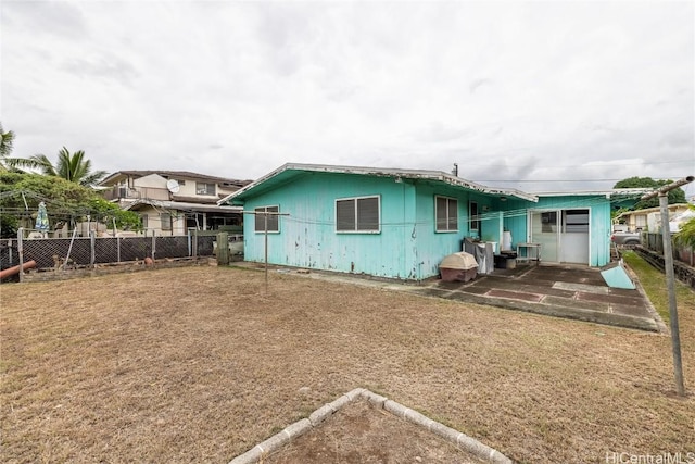 rear view of property featuring a patio