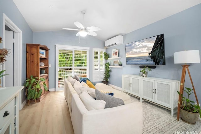 living room with lofted ceiling, ceiling fan, light wood-type flooring, and an AC wall unit