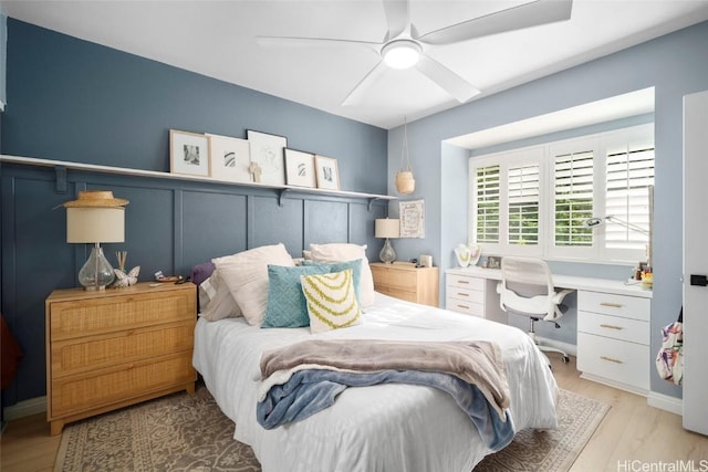 bedroom with ceiling fan and light wood-type flooring