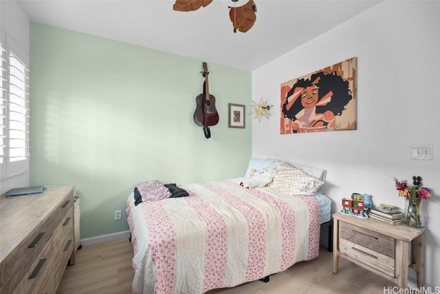 bedroom featuring ceiling fan and light hardwood / wood-style flooring