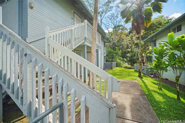 view of side of property with a lawn