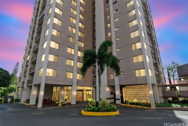 view of outdoor building at dusk