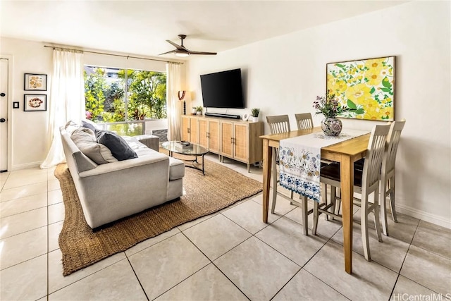 living room featuring ceiling fan and light tile patterned floors