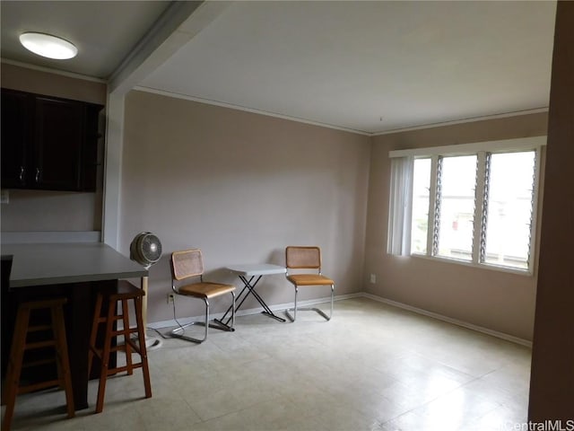 sitting room with crown molding