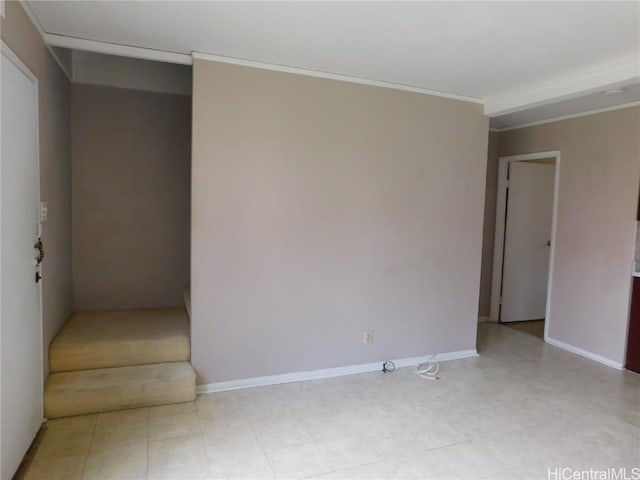 spare room with crown molding