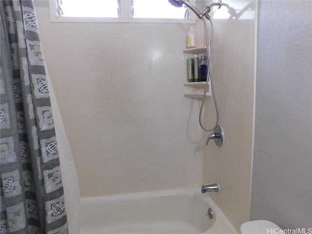 bathroom with shower / bathtub combination with curtain