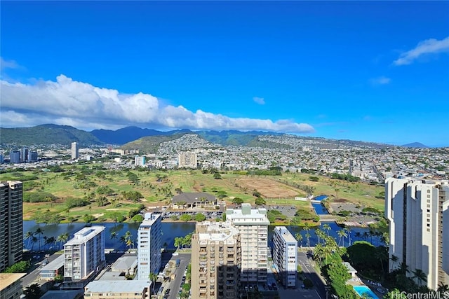 birds eye view of property with a water and mountain view