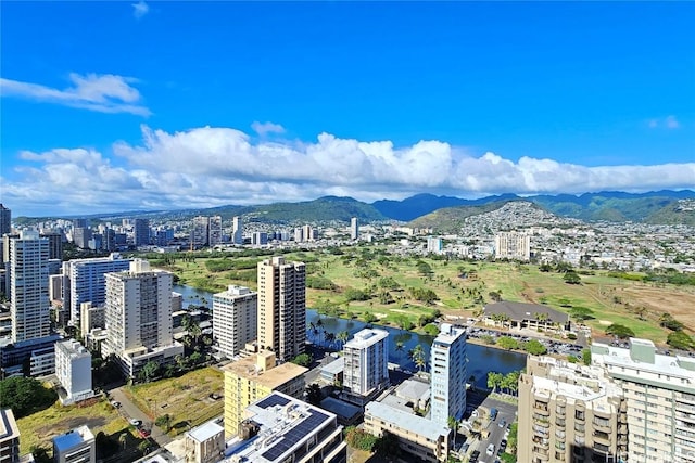 drone / aerial view featuring a water and mountain view