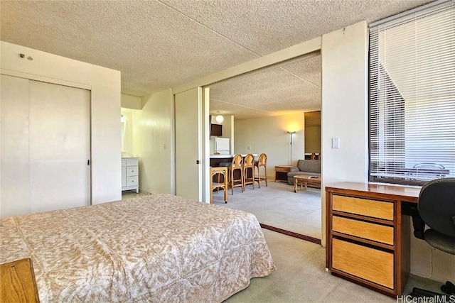 carpeted bedroom with a textured ceiling