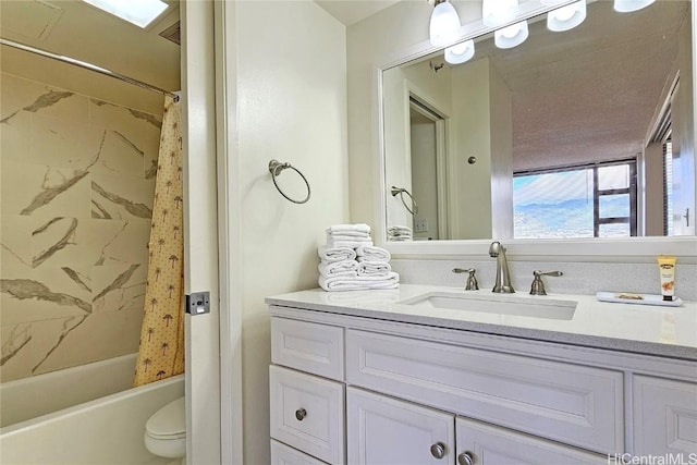 full bathroom featuring shower / tub combo, vanity, and toilet