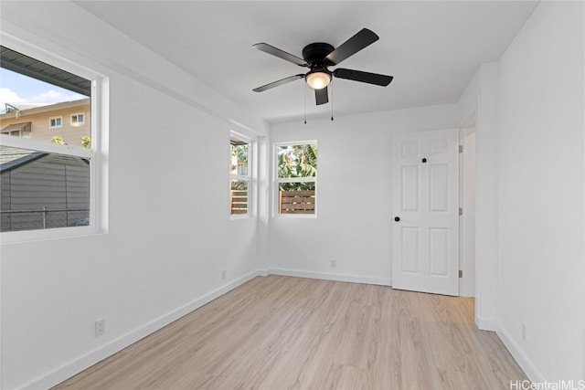 unfurnished room with light wood-type flooring and ceiling fan