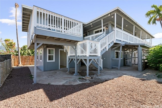 rear view of house with a wooden deck