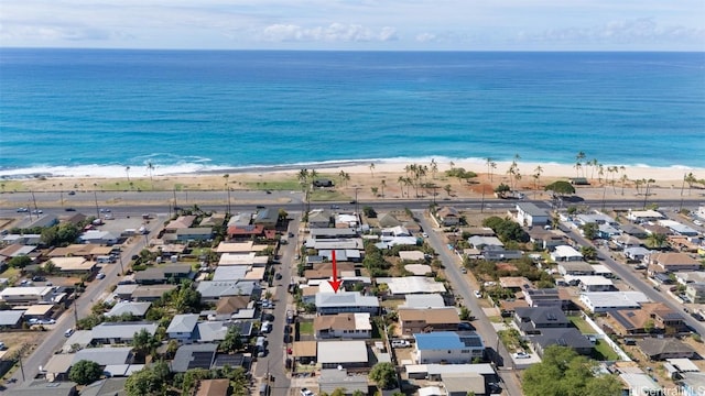 aerial view with a water view and a beach view