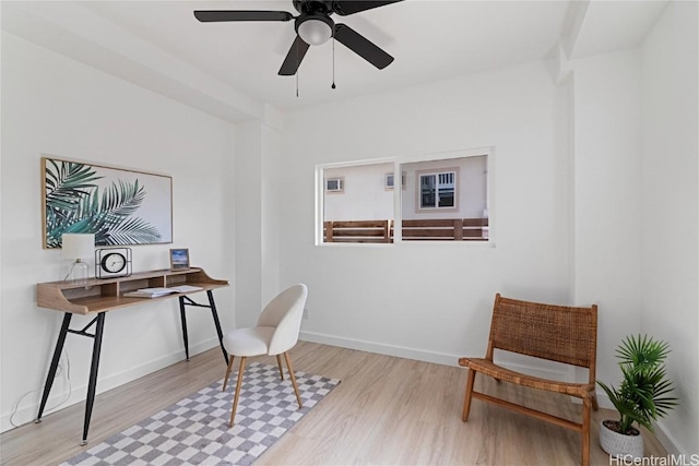 office space with ceiling fan and light wood-type flooring