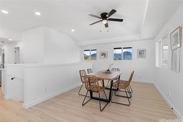 dining room with ceiling fan and light hardwood / wood-style flooring