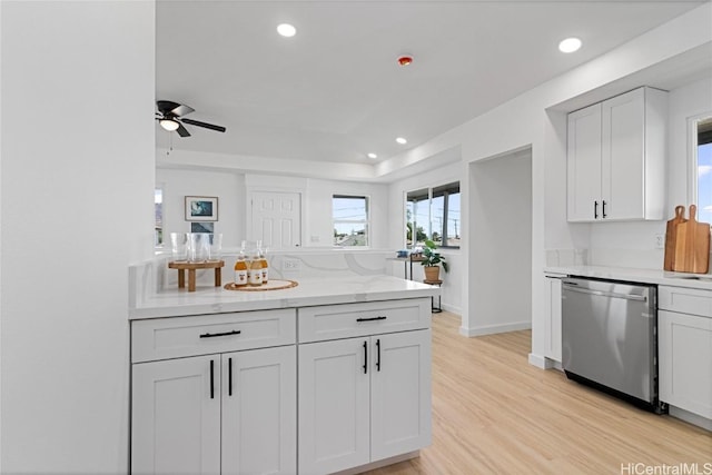 kitchen featuring white cabinetry, ceiling fan, stainless steel dishwasher, and light wood-type flooring