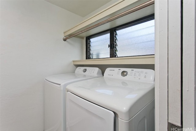 clothes washing area featuring washing machine and dryer