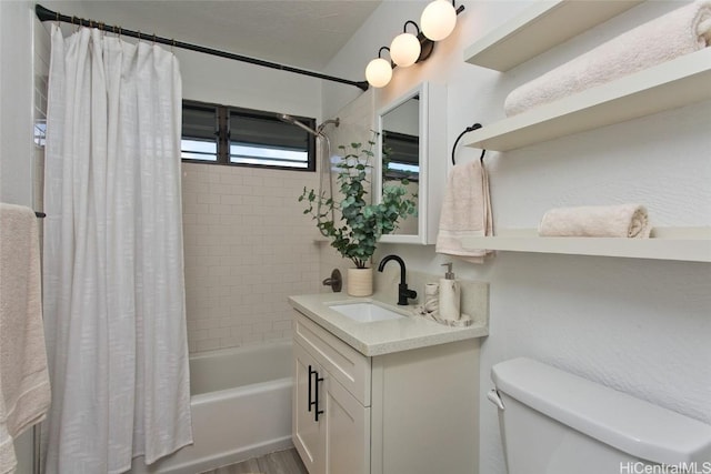 full bathroom featuring vanity, toilet, and shower / bath combo with shower curtain