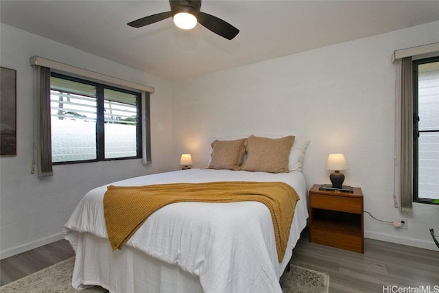 bedroom featuring hardwood / wood-style flooring and ceiling fan