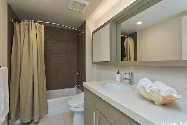 full bathroom with toilet, vanity, and shower / bathtub combination with curtain