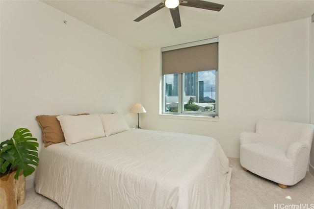 bedroom featuring ceiling fan and light carpet