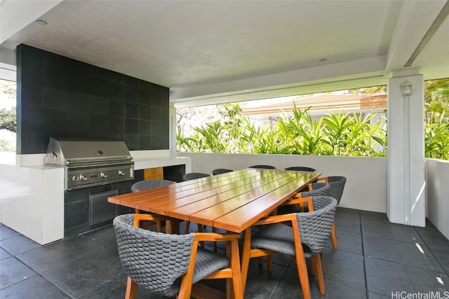 view of patio / terrace with area for grilling and a grill