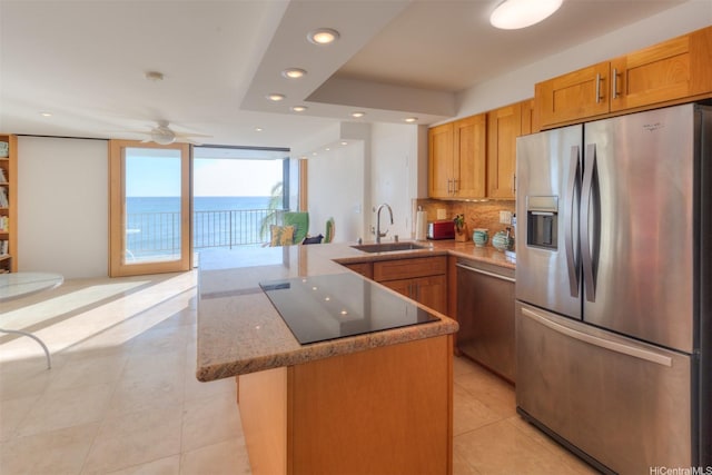 2987 Kalakaua Ave Unit 706, Honolulu, HI 96815 - kitchen featuring stainless steel appliances, a peninsula, recessed lighting, light tile patterned floors, and backsplash