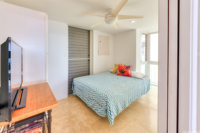 2987 Kalakaua Ave Unit 706, Honolulu, HI 96815 - bedroom featuring light tile patterned floors and a ceiling fan