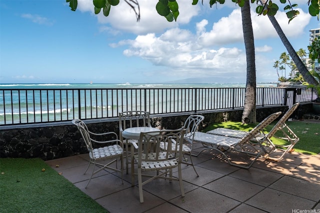 2987 Kalakaua Ave Unit 706, Honolulu, HI 96815 - view of patio / terrace with a water view and outdoor dining area