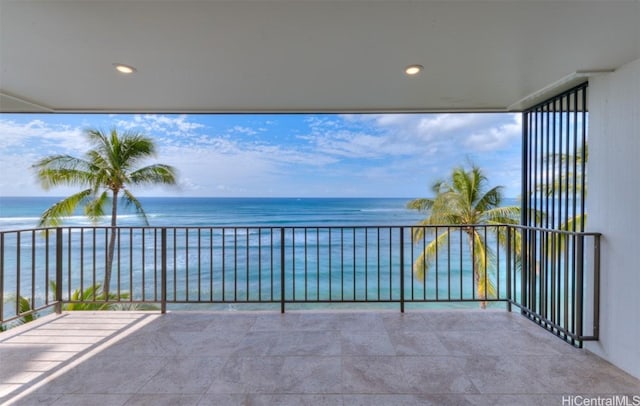 balcony featuring a water view