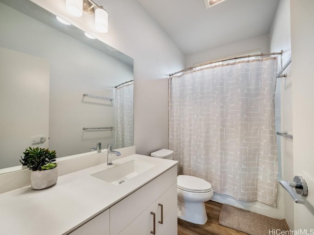 full bathroom featuring shower / bath combination with curtain, toilet, wood-type flooring, and vanity