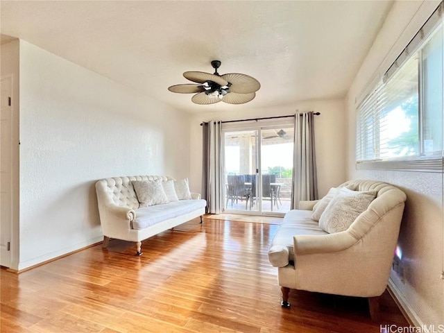 sitting room with ceiling fan and light hardwood / wood-style floors